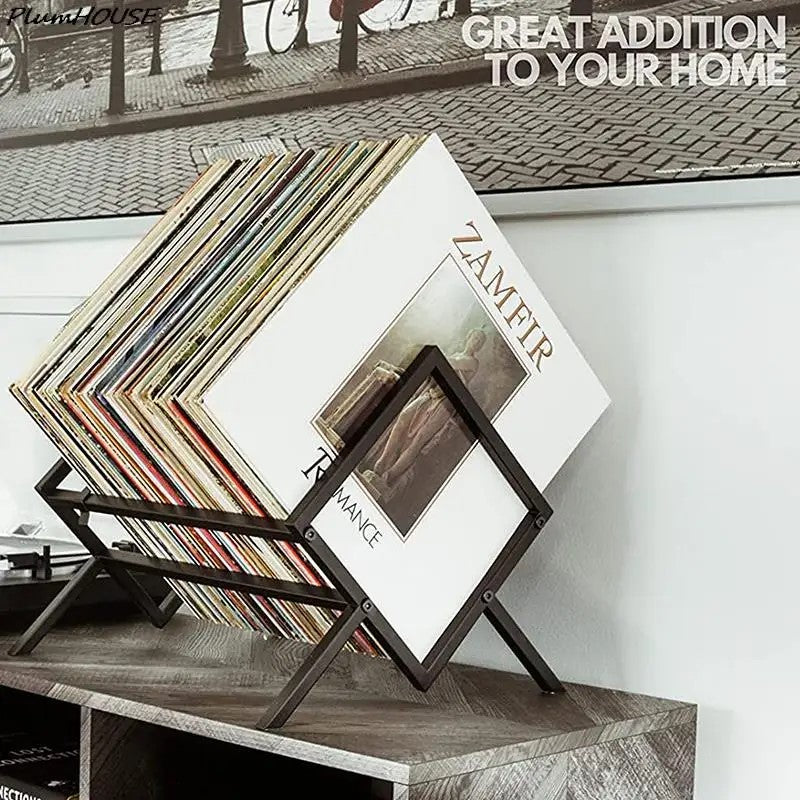 A single tier metal rack with records on a side table